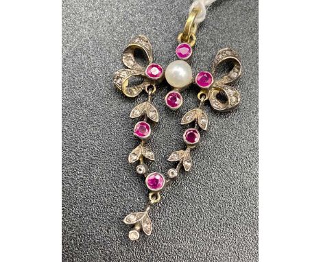 VINTAGE RUBY AND DIAMOND DOUBLE BOW DROP ARTICULATED PENDANT WITH FURTHER SWING CENTRE DROP AND ORIGINAL DIAMOND BALE AND CEN