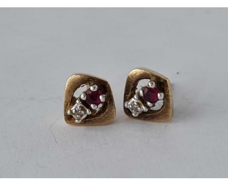 A pair of ruby and diamond stud earrings, 9ct