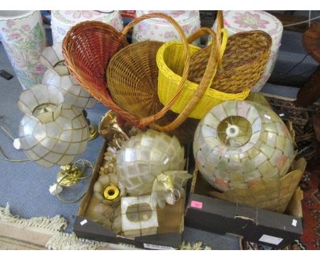 A collection of vintage shades, together with a pair of table lamps and wicker baskets 