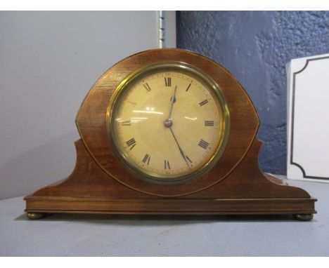 An Edwardian mahogany mantle clock having a silvered dial with Roman numerals, 5 1/2"h x 9"w 