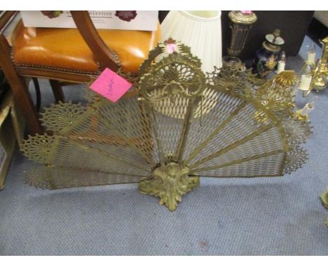 An early to mid 20th century brass fan firescreen 
