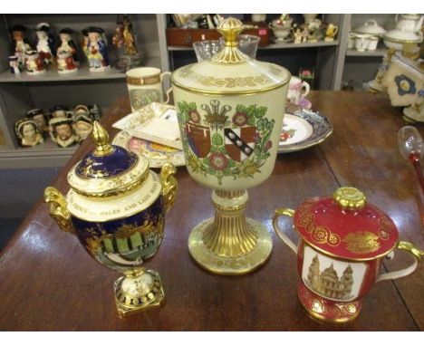 Three commemorative cups and covers, comprising a Coalport St Paul's limited edition 57/250, Spode limited edition 220/500 an