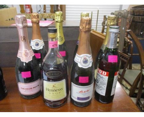 Six bottles of sparkling wine, a bottle of Pernod and a Hennessy VSOP Cognac 