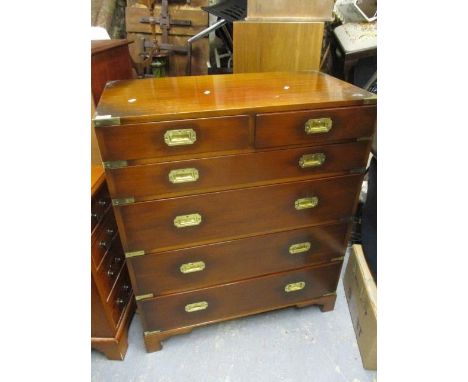 A reproduction military style chest of two and four long graduated drawers, on bracket feet, 40" h x 34 1/4"w 