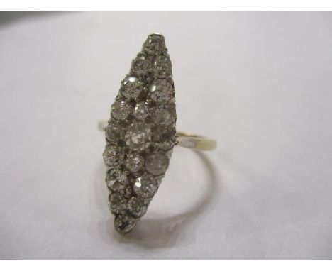 A lozenge shaped diamond cluster ring set in a yellow and white metal mount 