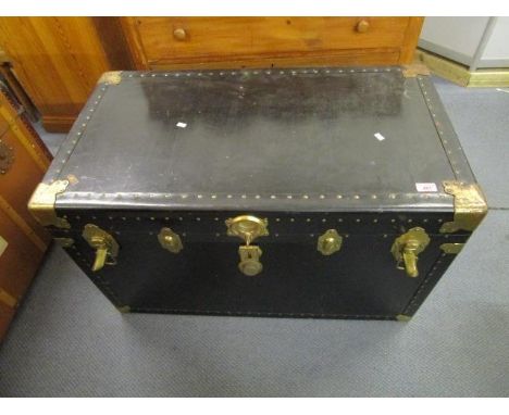 A good Herald steamer trunk with brass coloured mounts and studwork 