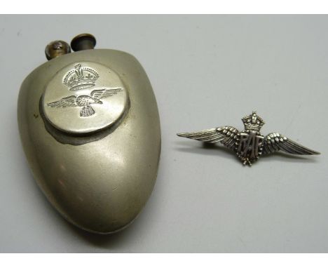 A silver RAF brooch and a trench art lighter made out of two spoons 