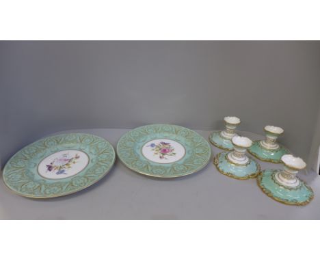Four Royal Crown Derby dwarf candlesticks and a pair of Royal Worcester dinner plates 
