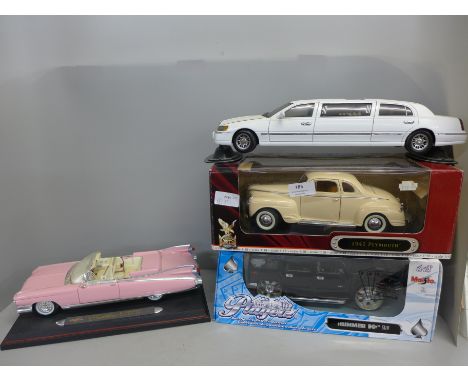 Four 1/18th scale model vehicles, Maisto Hummer SUV, Signature 1941 Plymouth, Maisto Pink Cadillac Eldorado and a limousine, 