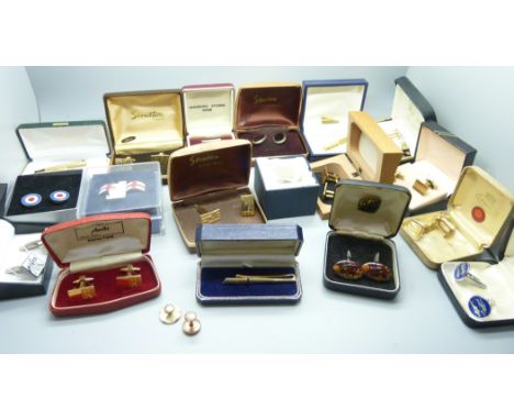 A collection of boxed cufflinks and tie-pins 