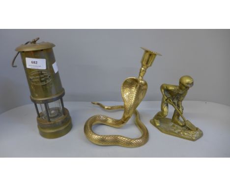 A Ferndale Coal Mining Co. miners lamp, a brass model of a miner and a brass cobra candlestick 