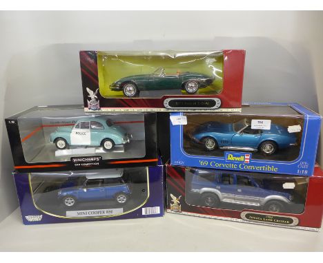 Five 1/18th scale model vehicles; Revell 69 Corvette Convertible, Signature 1971 Jaguar E-Type, Minichamps Morris Minor Polic