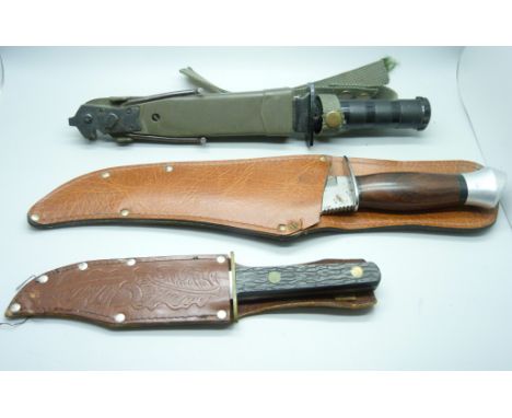 Three hunting knives, one by William Rodgers and one marked Buffalo Hunter 