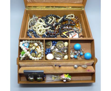 A jewellery box containing costume jewellery and wristwatches 