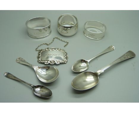 Silver including a Victorian spoon, a caddy spoon and three napkin rings, 135g 