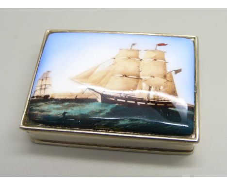 A 925 silver snuff box with enamel plaque to the lid, decorated with a tall masted ship, 55mm wide 