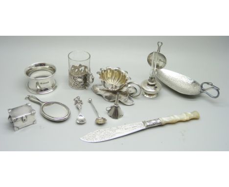 Silver items comprising a small oil lamp, a small enamelled mirror, napkin ring, salt spoons, caddy spoon, a Victorian silver