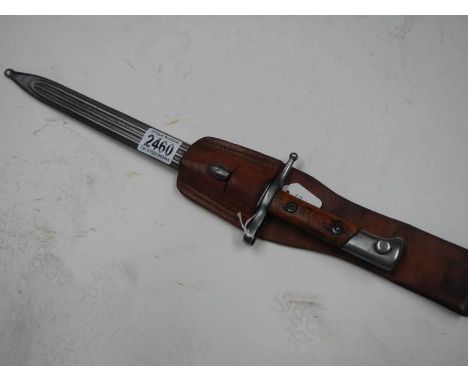 A bayonet stamped E8993 with scabbard and leather frog, blade 29.5 cm.