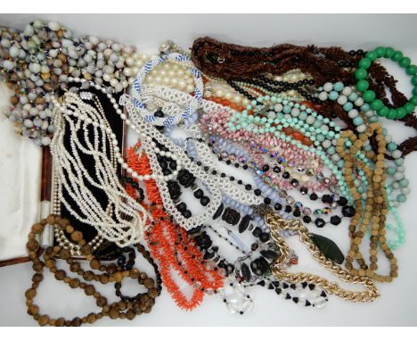 A triple strand of freshwater pearls, carnelian beads and other vintage items Condition Report: Not available for this lot