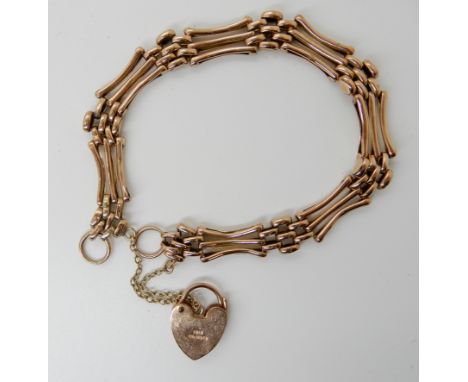 A 9ct gold gate bracelet with heart shaped clasp, weight 8.4gms Condition Report: Available upon request