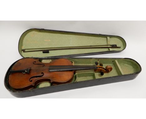 A two piece back violin 35cm with indistinct label to the interior of Antonious Stradivarius made in Germany with a bow and c
