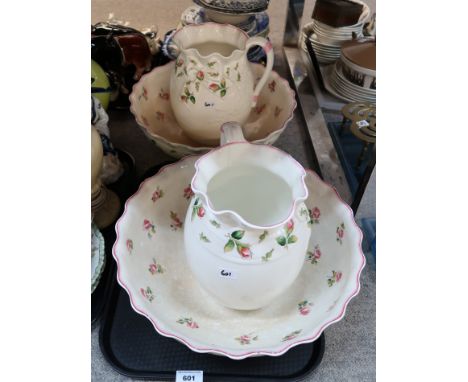 A pair of Minton washbowls and ewers decorated with rose buds Condition Report: Available upon request