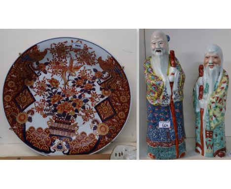 A large imari charger and two ceramic figures Condition Report: Available upon request