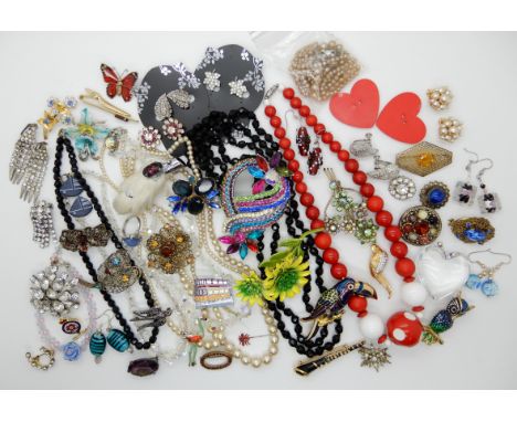 A large toucan brooch, a clarinet brooch and other items Condition Report: Not available for this lot