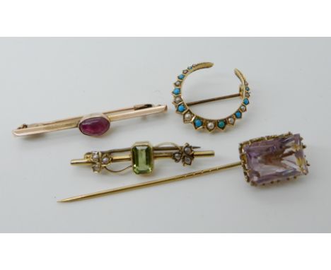A continental gold ruby set brooch, a 15ct peridot and pearl brooch, a yellow metal turquoise and pearl crescent moon brooch 