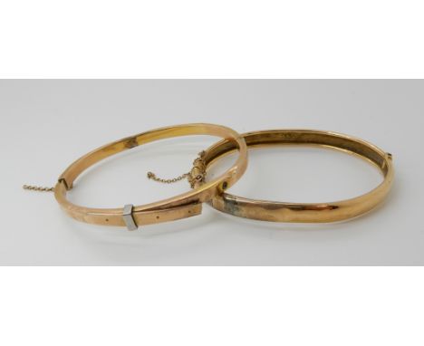 A 15ct gold bangle weight 8.3gms and a yellow metal bangle also 8.3gms Condition Report: Available upon request