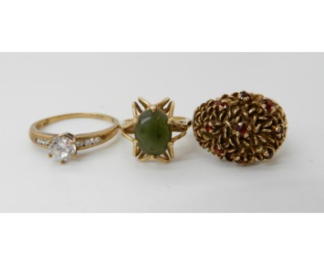 A 9ct gold garnet dome ring, size O, a 10k New Zealand jade set retro ring size L and a 9ct gold cz set ring size W1/2, 13.4g