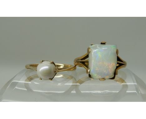 A yellow metal ring set with an opal (af) size K and a yellow metal pearl set ring size L1/2, combined weight 6.1gms Conditio