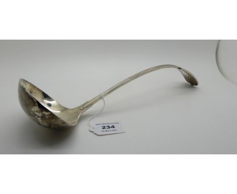 A silver soup ladle, Sheffield 1925, fiddle pattern, with oval bowl and curved stem, the terminal with shell motif and monogr