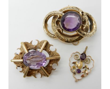 Two yellow metal amethyst set brooches and a pendant, weight 20.5gms Condition Report: Available upon request