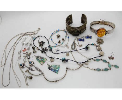 A white metal bangle set with an amber, silver earrings, bangles pendants etc Condition Report: Not available for this lot