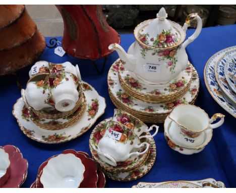 A Royal Albert Old Country Roses tea and dinner service comprising teapot, six cups, seven saucers, six side plates, dinner p