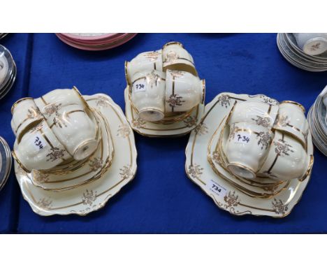 A Royal Albert cream ground teaset with gilt decoration comprising twelve cups, saucers and plates, two cake plates Condition