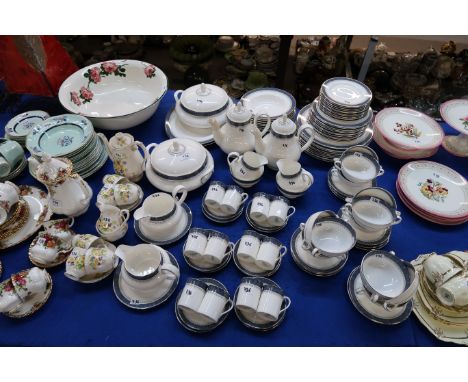 An extensive Royal Doulton Sherbrooke dinner service comprising eleven dinner plates, twelve medium plates, side plates, bowl