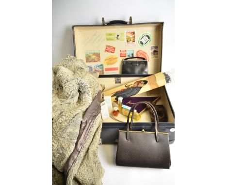 A vintage travel trunk,  containing various vintage perfumes, toiletries, and human hair (10+)