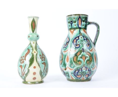 Attributed to Hannah Jones for Della Robbia Pottery (Birkenhead 1894-1906),  a jug with foliate sgraffito design in the Arabe