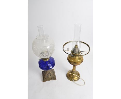 An early 20th Century oil lamp,  Duplex, 'Made in England', together with another blue glass example (2)