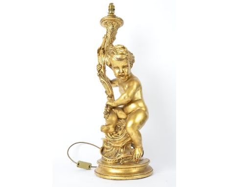 A gilt lamp in the form of a cherub,  approximate height 74cm, sold for decorative purposes