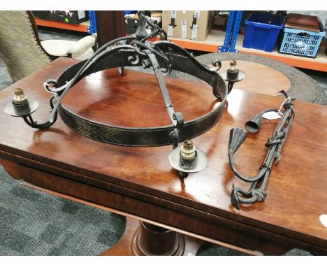 An iron ceiling light with four branches, approximate length 64cm, together with a candle holder, height 39cm (2)