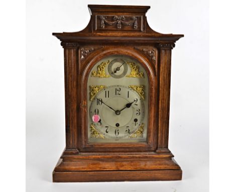 A 19th Century oak cased mantel clock,  eight day movement, stamped 3303, silvered dial with Arabic numerals and a subsidiary