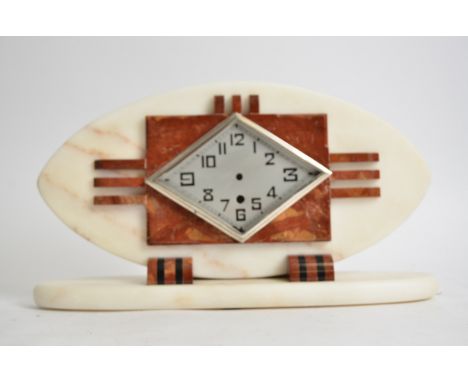 A French Art Deco mantel clock,  in red and white marble, silvered face with Arabic numerals and a modern electric movement, 