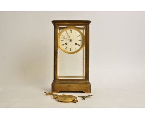 A brass four-glass mantel clock, with Roman numerals and enamel dial, height 30.5cm 