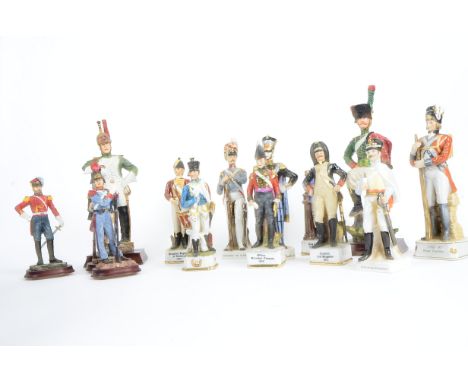 Fourteen 20th Century figures of soldiers, to include "Drummer Regiment of Artillery 1812", "1792 - 97 Royal Fusiliers", heig