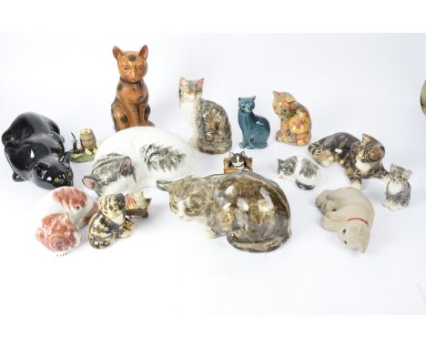 Sixteen figures of cats,  to include some examples from the Winstanley pottery, the largest 14cm x 30cm, a Poole Pottery piec