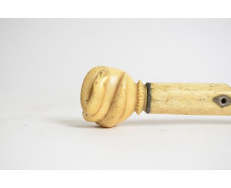 A Victorian carved ivory walking stick,  taking the form of a hand grasping a coiled snake, length 81cm