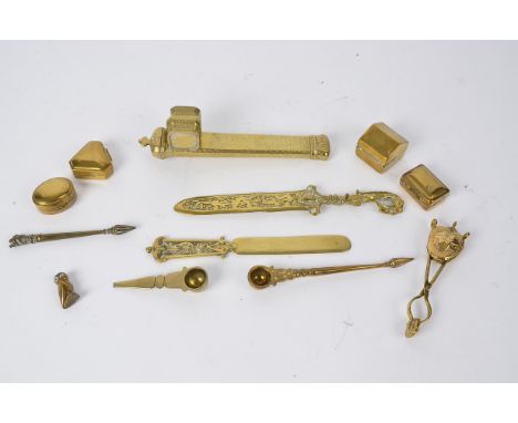 A brass Anglo Indian inkwell and pen holder,  with decoration of birds, length 19cm, together with a mythical beast letter op